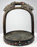 Elite riding stirrup with cast bronze construction, protective dragon motifs, and hand-set coral and turquoise ornament.