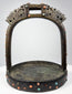 Elite riding stirrup with cast bronze construction, protective dragon motifs, and hand-set coral and turquoise ornament.