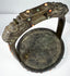 Late Qing period ceremonial stirrup decorated with coral, turquoise, and glass cabochons set into cast bronze.