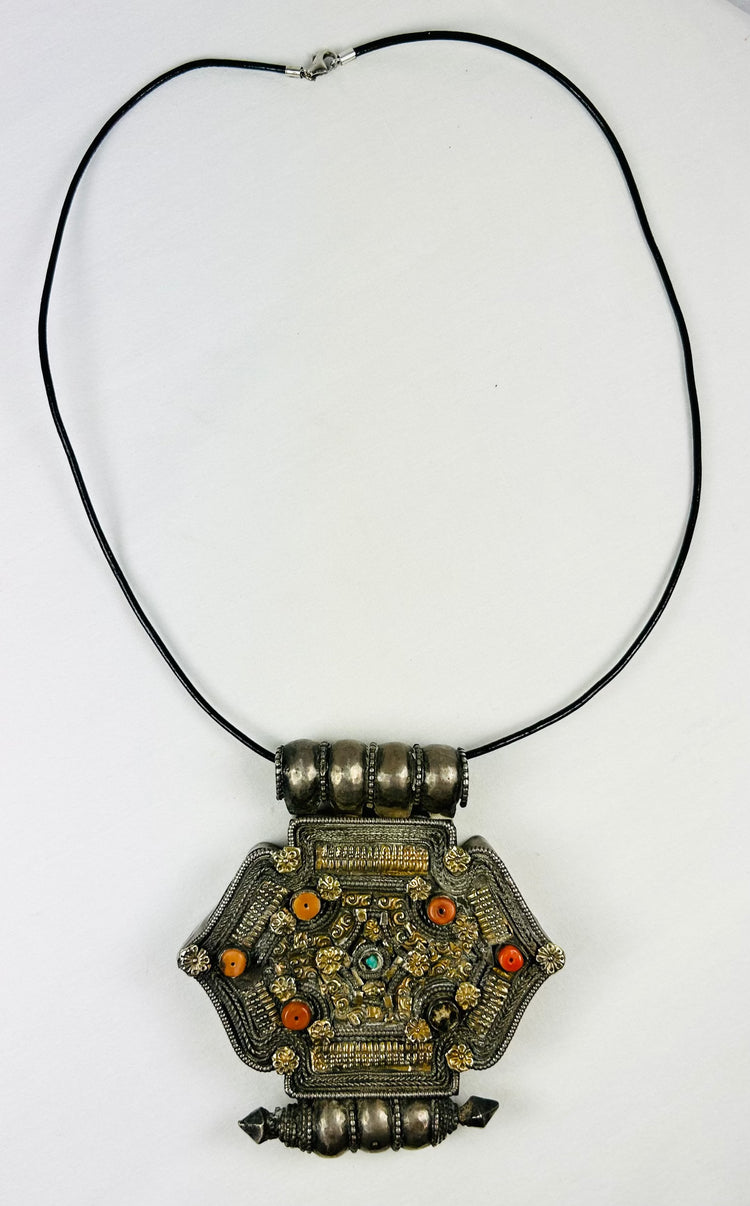 Tibetan-Nepalese gau amulet pendant with coral, turquoise, and hollow reliquary cavity