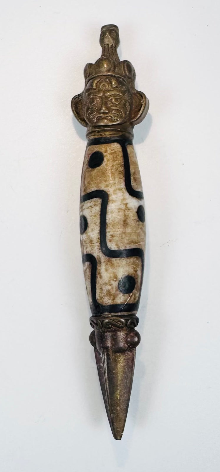 Early 20th-century Tibetan phurba-style amulet with geometric hardstone bead