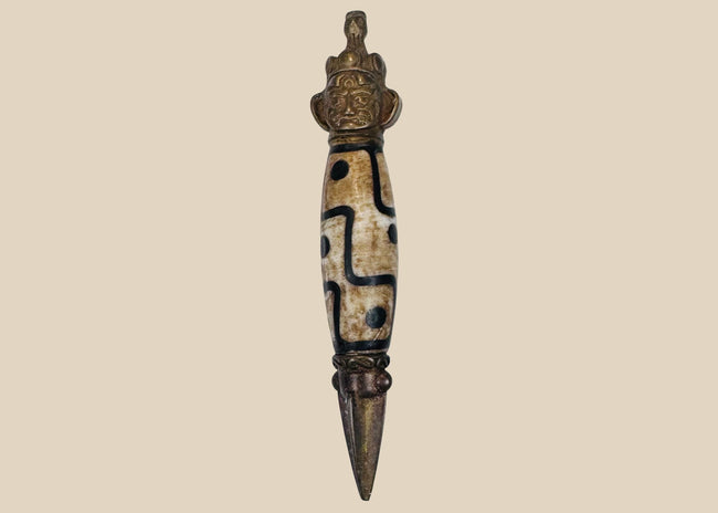 Tibetan Dzi-style bead phurba amulet with copper-alloy fittings and trihedral blade