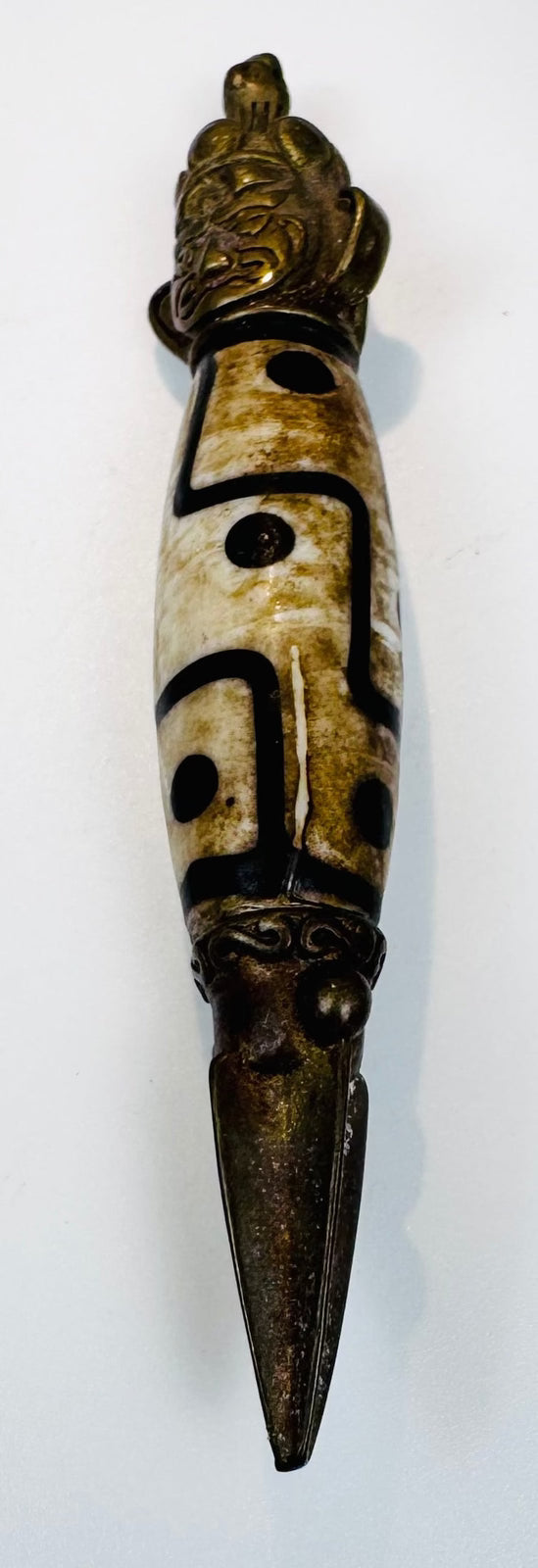 Antique Tibetan-style protective amulet combining Dzi bead imagery and phurba form