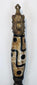 Side view of Himalayan phurba amulet with elongated patterned bead and pointed blade