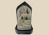 14th-century carved stone stele from West Tibet depicting the Buddhist deity Tara, “Mother of Liberation,” mounted on a black base, showing detailed facial features and traditional iconography, 6 inches tall.