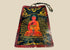 Late Qing Dynasty Tibetan devotional plaque, circa 19th century, hand-painted with vivid polychrome depiction of a seated Buddha in red and gold robes, surrounded by radiant aureole and cloud motifs; crafted on a rectangular wooden panel with suspension cord, showing surface wear and patina from ritual use.
