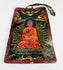Hand-painted Tibetan devotional plaque on bone depicting the Buddha seated on a lotus throne