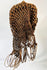 Wooden Chokwe ceremonial mask with intricate forehead patterns and adornments