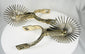 Vintage Chilean horse riding spurs with ornate metalwork and rotating rowels