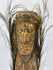 Ethnographic Sepik River wood figure with expressive face, pigments, and aged surface