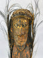 Ethnographic Sepik River wood figure with expressive face, pigments, and aged surface