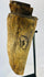 Profile view of ethnographic ritual mask emphasizing wood grain, aged texture, and ceremonial wear.