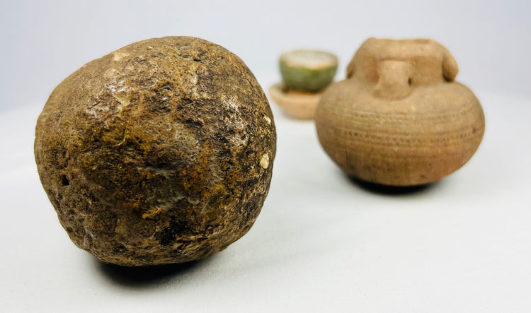 Ancient East Asian green-glazed ritual cup on stand, aged glaze with chipping and devotional wear.