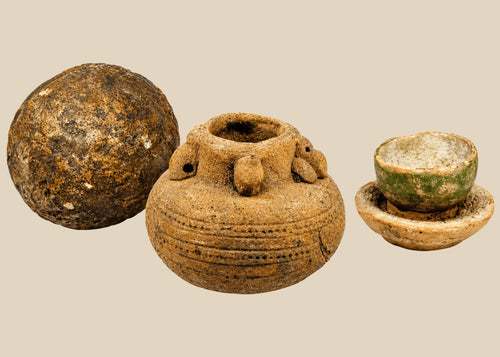 Dense, smooth, near-spherical stone with natural patina and weathering marks, possibly used as a grinding implement, pestle, or projectile, Southeast Asia or Indian Subcontinent, diameter 3 in, age unknown (possibly several centuries to over 1,000 years).