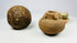 Three-piece antiquities grouping: spherical stone tool, miniature terracotta jar, and green-glazed ceremonial cup.
