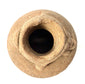 Top-down view into dark opening of ancient clay vessel with rolled rim