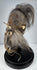 Amazonian shrunken head replica with stitched facial features, textured hide surface, and long horse hair, circa 1950s–1960s.