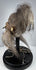 Mid-century ethnographic curiosity modeled after a Jivaroan tsantsa, with sewn facial details and natural horse hair.