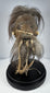 Mid-20th-century Amazonian-style shrunken head replica crafted from stitched animal hide with horse hair and preserved in a glass globe.