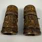 Tibetan Buddhist devotional prayer wheel with carved Buddha figures and sacred inscriptions