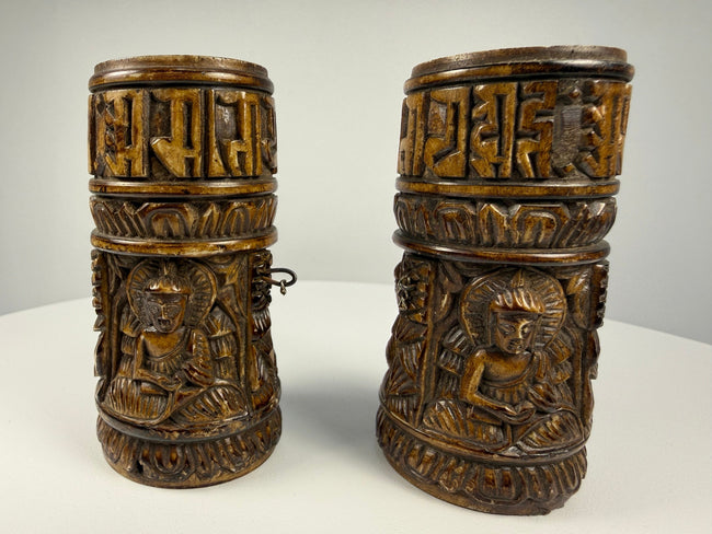 Historic Tibetan ritual prayer wheel made from human thigh bone with intricate Buddhist carvings
