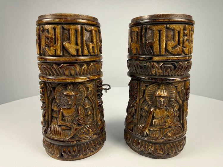 Pair of Tibetan Buddhist prayer wheels carved from human femur bone with Buddha relief figures