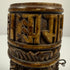 Tibetan Buddhist bone prayer wheel with three Buddha images in different mudra positions