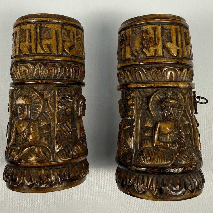 Antique Tibetan bone carving with seated Buddha figure and detailed ritual decoration