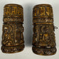 Antique Tibetan bone carving with seated Buddha figure and detailed ritual decoration