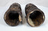 Relief-carved Buddhist figures and sacred inscriptions preserved on 18th–19th century Tibetan human bone prayer wheels.