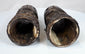 Relief-carved Buddhist figures and sacred inscriptions preserved on 18th–19th century Tibetan human bone prayer wheels.