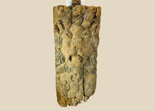 Hand-carved hardwood Baroque lion mascaron corbel with swirling mane, traces of original blue-grey paint, gesso, and parcel gilding, integral tenon and fixing holes for architectural mounting, late 17th–early 18th century, Europe, circa 1650–1750.