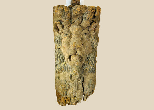 Hand-carved hardwood Baroque lion mascaron corbel with swirling mane, traces of original blue-grey paint, gesso, and parcel gilding, integral tenon and fixing holes for architectural mounting, late 17th–early 18th century, Europe, circa 1650–1750.