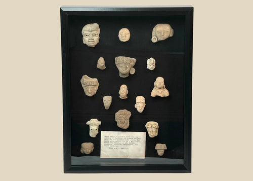 Pre-Columbian Mesoamerican terracotta fragments shadowbox, 16 votive heads, busts, and maskettes from Teotihuacan and Veracruz traditions, 200 BCE–900 CE, archaeological patina
