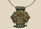 Hexagonal Himalayan gau pendant, silver-tone with parcel-gilt filigree, late 19th–early 20th century
