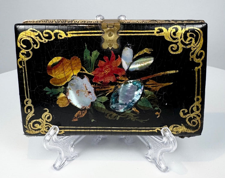 Antique Victorian calling card case with colorful floral decoration, mother-of-pearl inlay, and brass clasp
