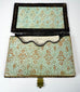 Open Victorian calling card case showing original-style patterned paper lining and shaped interior card pocket