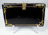 Victorian lacquered calling card case displaying mother-of-pearl floral ornament and decorative edge detailing