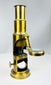 19th century portable brass microscope with mirror base and compact scientific design