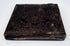 Antique cased photograph with ornate dark embossed exterior, decorative border, and age-related patina
