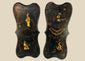 Pair of 19th-century Chinoiserie wall panels with hand-painted Asian-inspired figures, floral motifs, and gilt decoration on shaped black lacquered wood, circa 1850–1880.