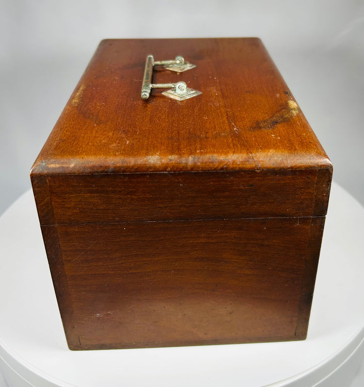 antique doctor’s traveling medicine case with glass bottles and corks