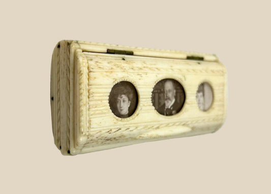 Victorian snuff box crafted from carved bone with three inset sepia portrait photographs under glass, brass hinges, mid–late 19th century.