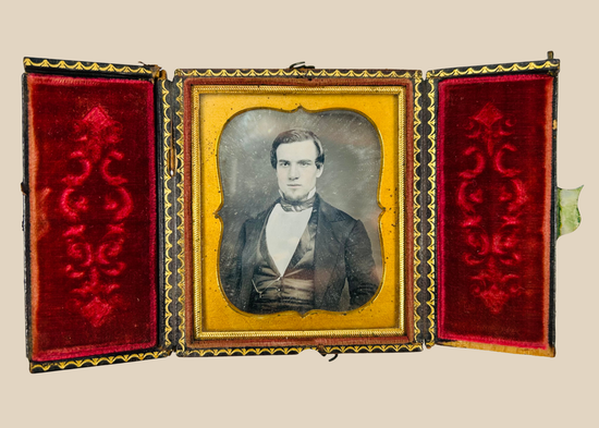 Mid 19th century cased portrait photograph of a Victorian gentleman with velvet interior and brass mat