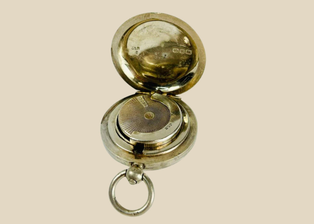 Victorian-era sterling silver sovereign holder with engraved monogram and spring-loaded mechanism, circa 1880s, United Kingdom. Compact and elegantly crafted for securely holding sovereign coins. Reflects 19th-century silverwork craftsmanship, utility, and personalized luxury accessories.