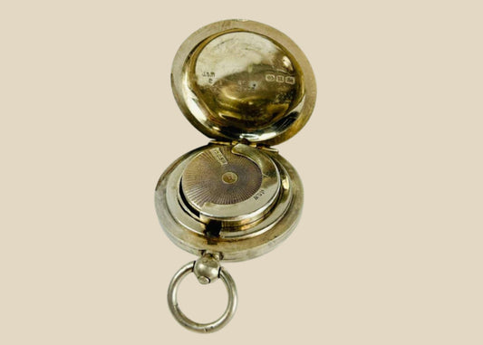 Victorian-era sterling silver sovereign holder with engraved monogram and spring-loaded mechanism, circa 1880s, United Kingdom. Compact and elegantly crafted for securely holding sovereign coins. Reflects 19th-century silverwork craftsmanship, utility, and personalized luxury accessories.