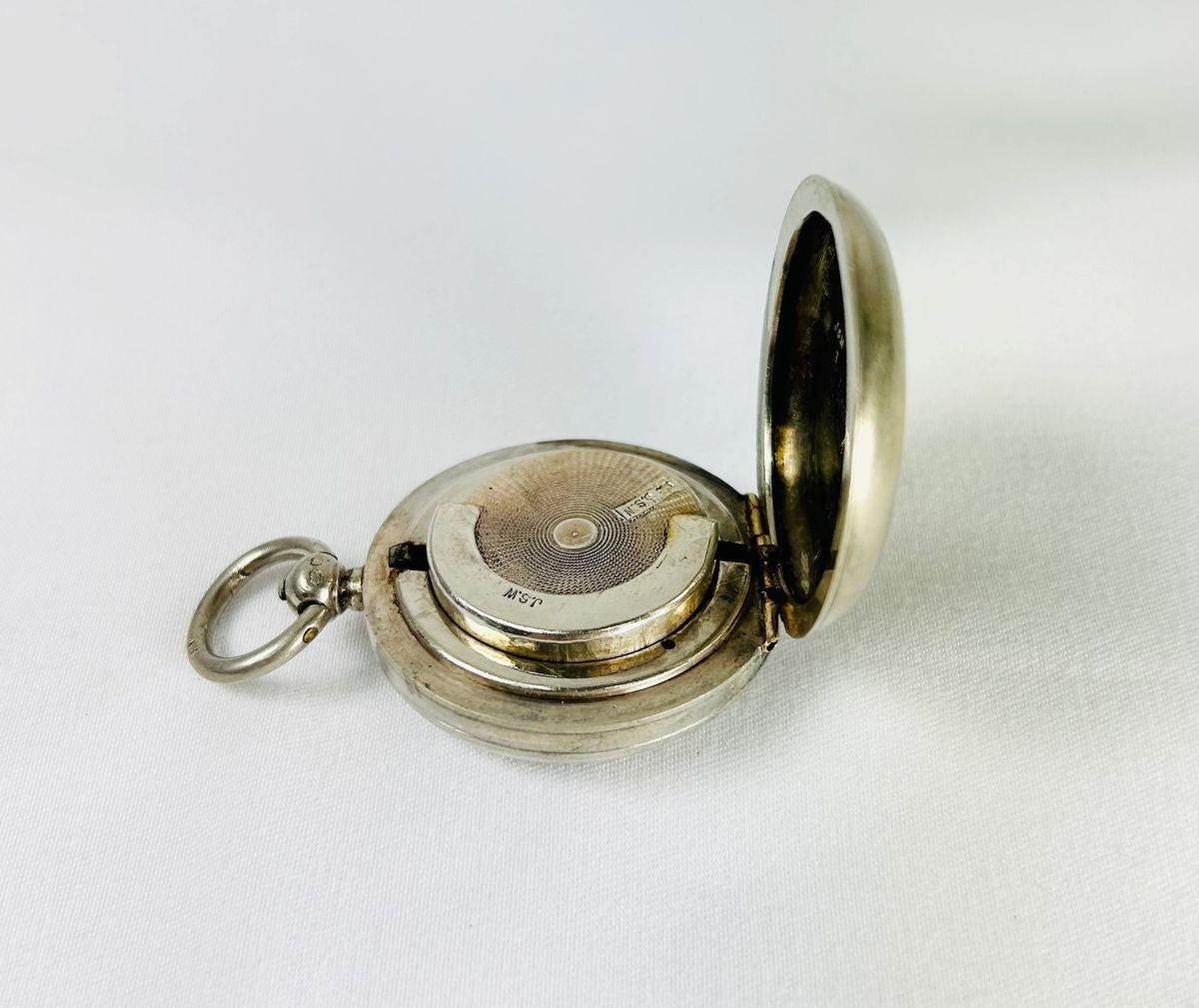 Victorian-era sterling silver sovereign holder with engraved monogram and spring-loaded mechanism, circa 1880s, United Kingdom. Compact and elegantly crafted for securely holding sovereign coins. Reflects 19th-century silverwork craftsmanship, utility, and personalized luxury accessories.