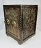 Antique safe-form still bank with decorative scrollwork and heavy cast iron body