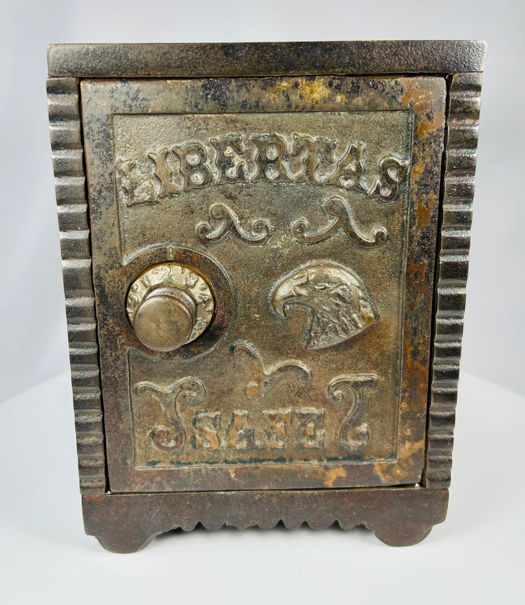 Vintage American cast iron safe bank with ornate Victorian detailing