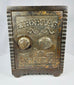 Vintage American cast iron safe bank with ornate Victorian detailing